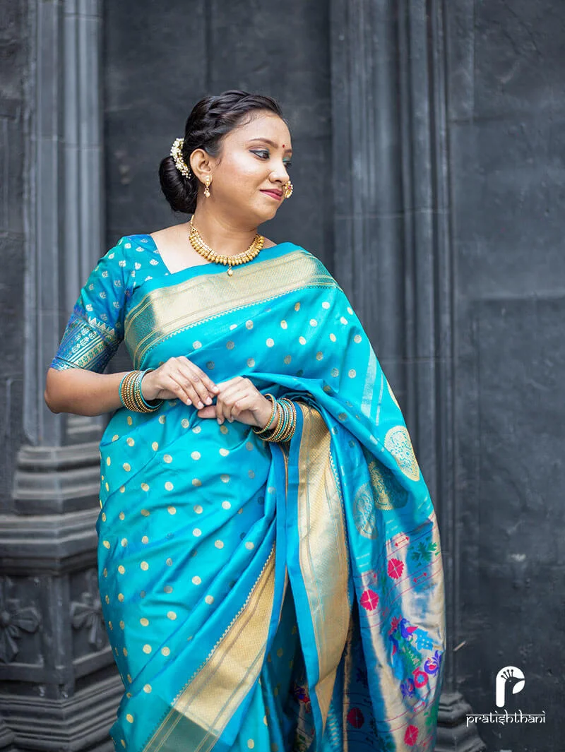 Exquisite Kalanjali Paithani saree in single-color sky blue with traditional motifs