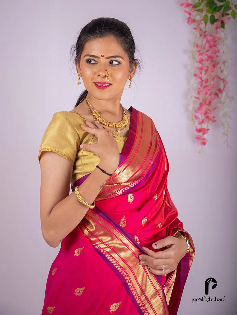 Ethnic butti on Yeola Pink Handloom Pure Silk Paithani Saree.