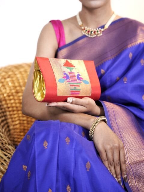 Red Paithani hand purse with traditional detailing