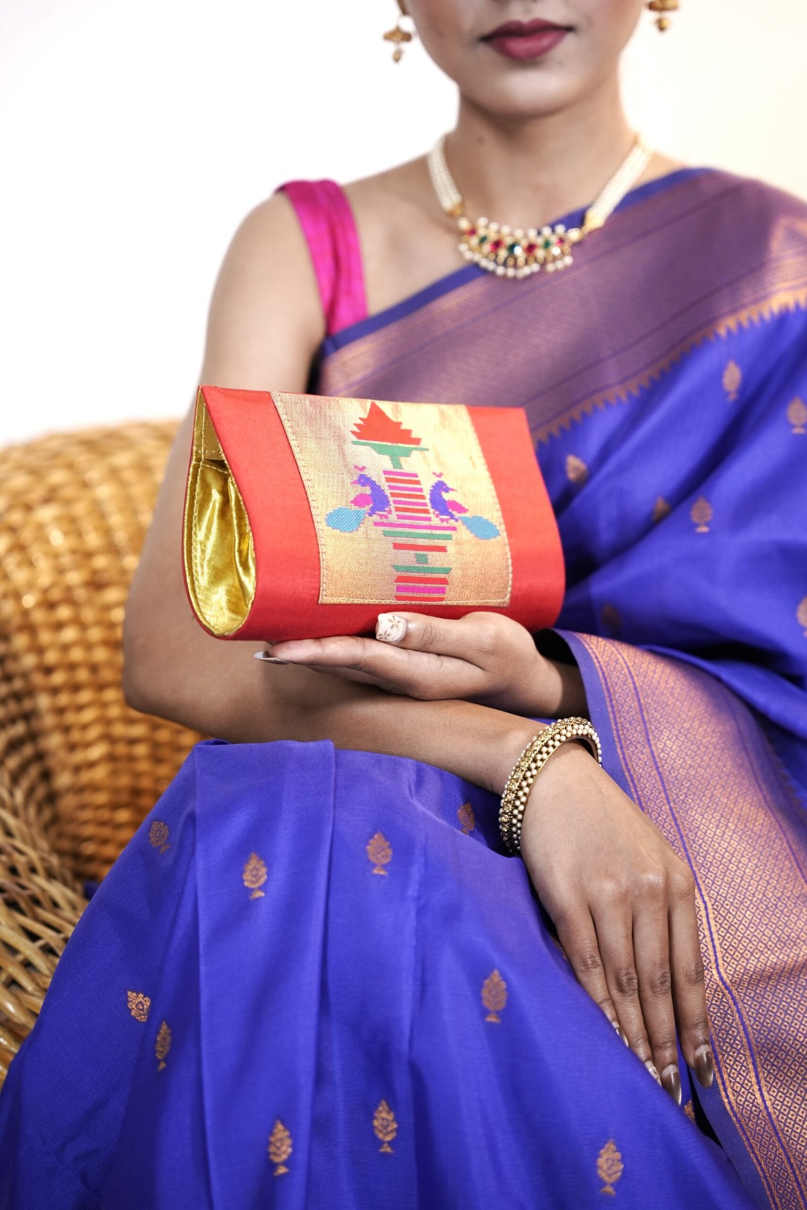 Red Paithani hand purse with traditional detailing