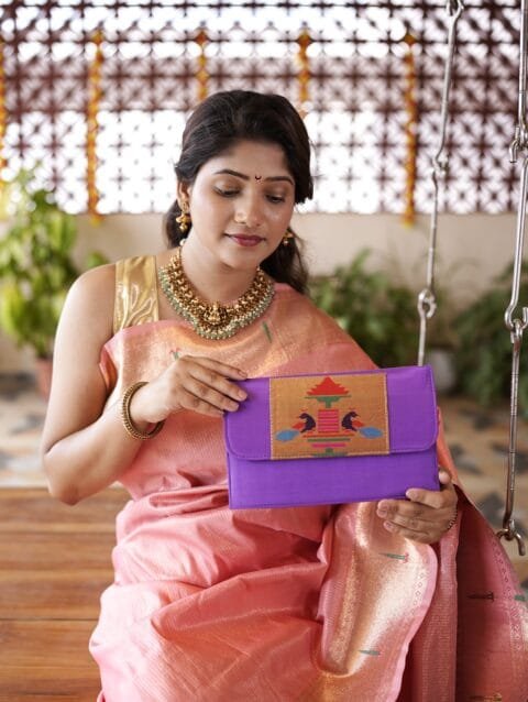 Handmade purple Paithani sling bag with traditional design
