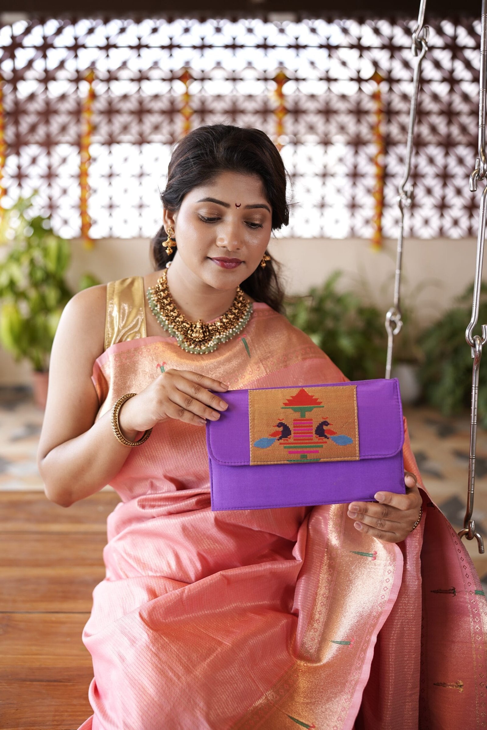 Handmade purple Paithani sling bag with traditional design