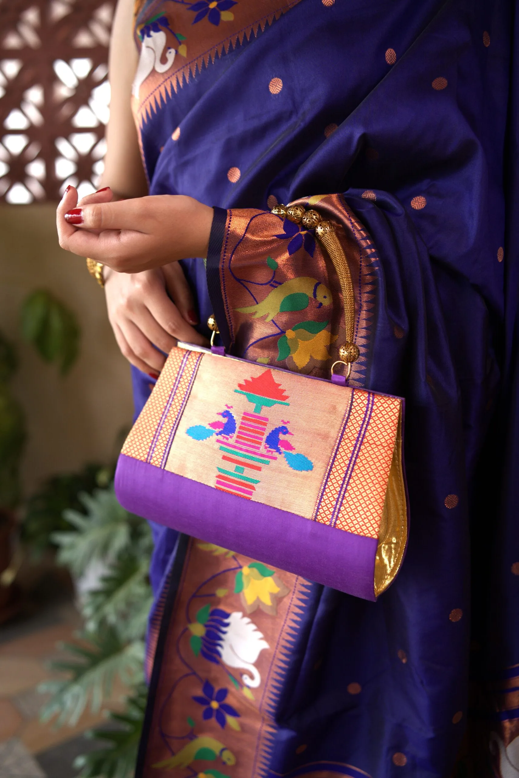 Handmade purple Paithani purse by Pratishthani